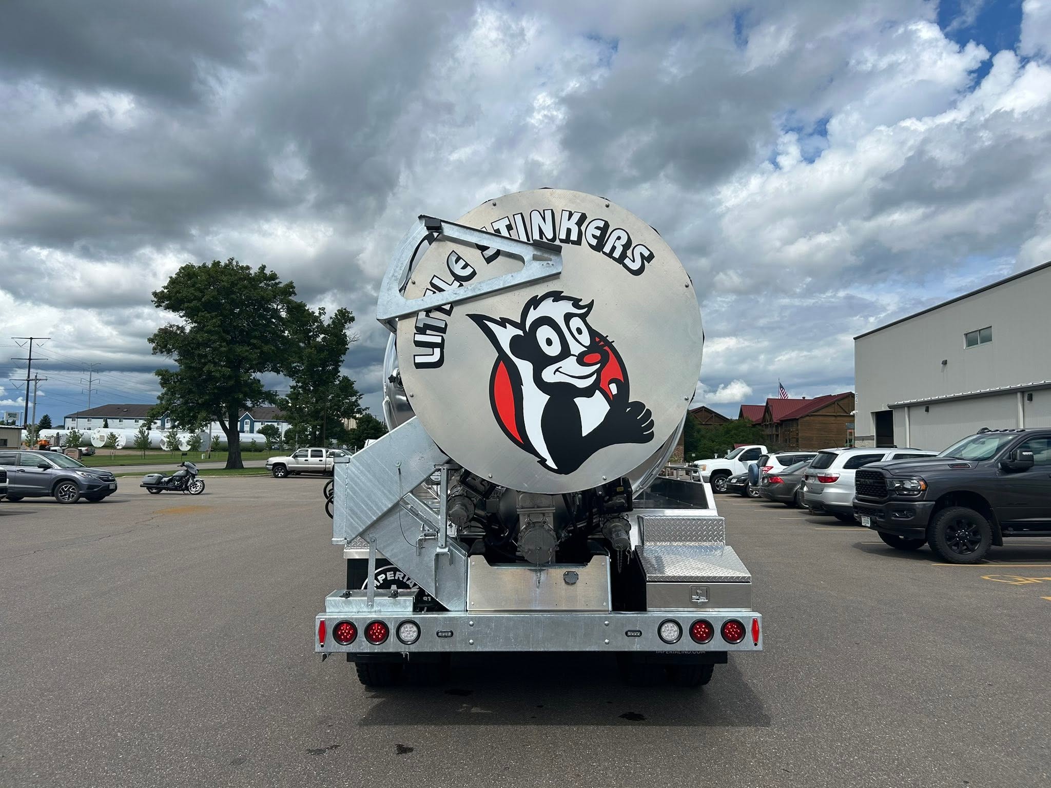 Little Stinkers chrome septic truck with skunk logo