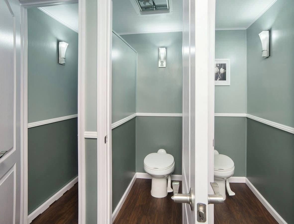 Bright, polished interior of a Little Stinkers luxury restroom trailer